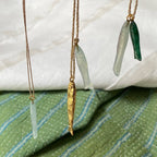 Collier poissons plaqué or et pierre calcédoine